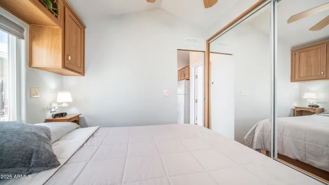 a bedroom with a bed and a closet