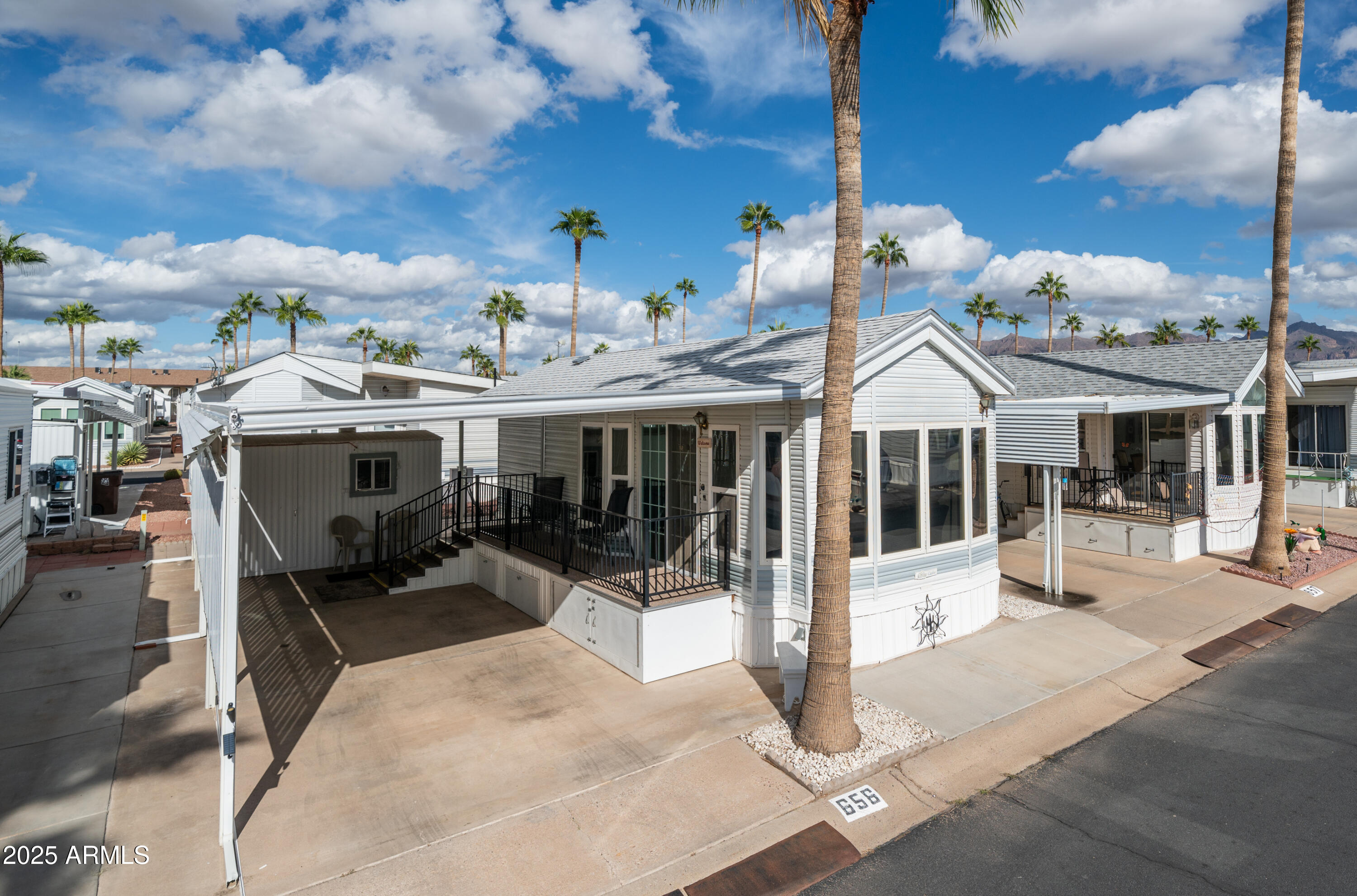 656 Gypsum Drive, Unit 656 Apache Junction, AZ 85119 - Photo 2 of 52 a view of a patio with a table and chairs