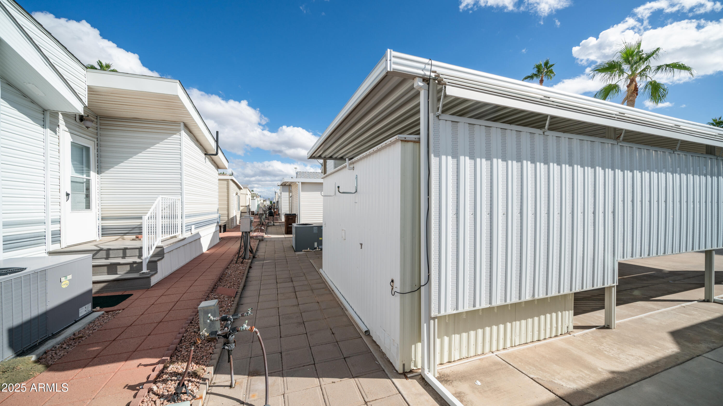 656 Gypsum Drive, Unit 656 Apache Junction, AZ 85119 - Photo 23 of 52 a view of a house with backyard and sitting area