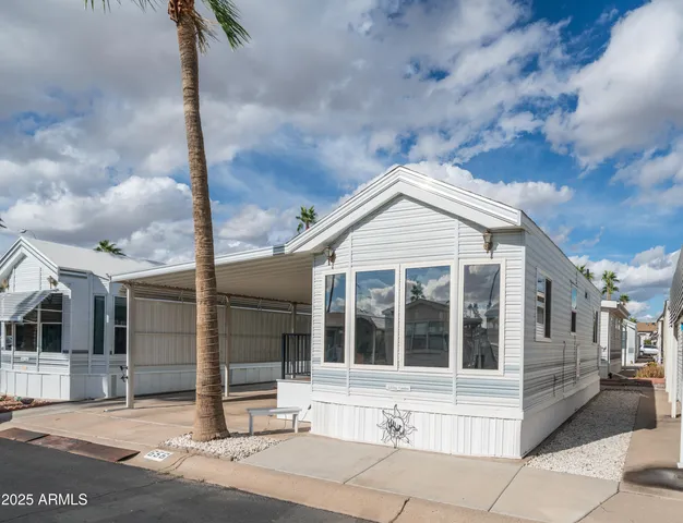 a view of a white house with a large windows