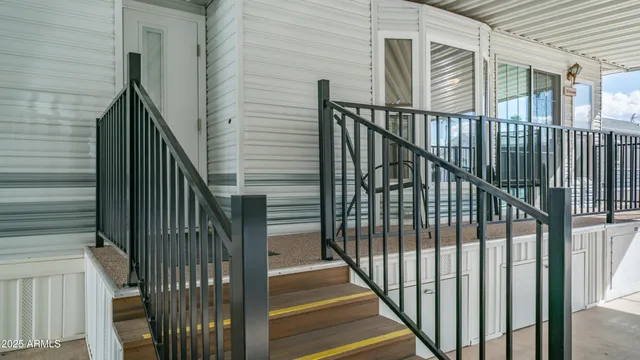 a view of a balcony with wooden floor