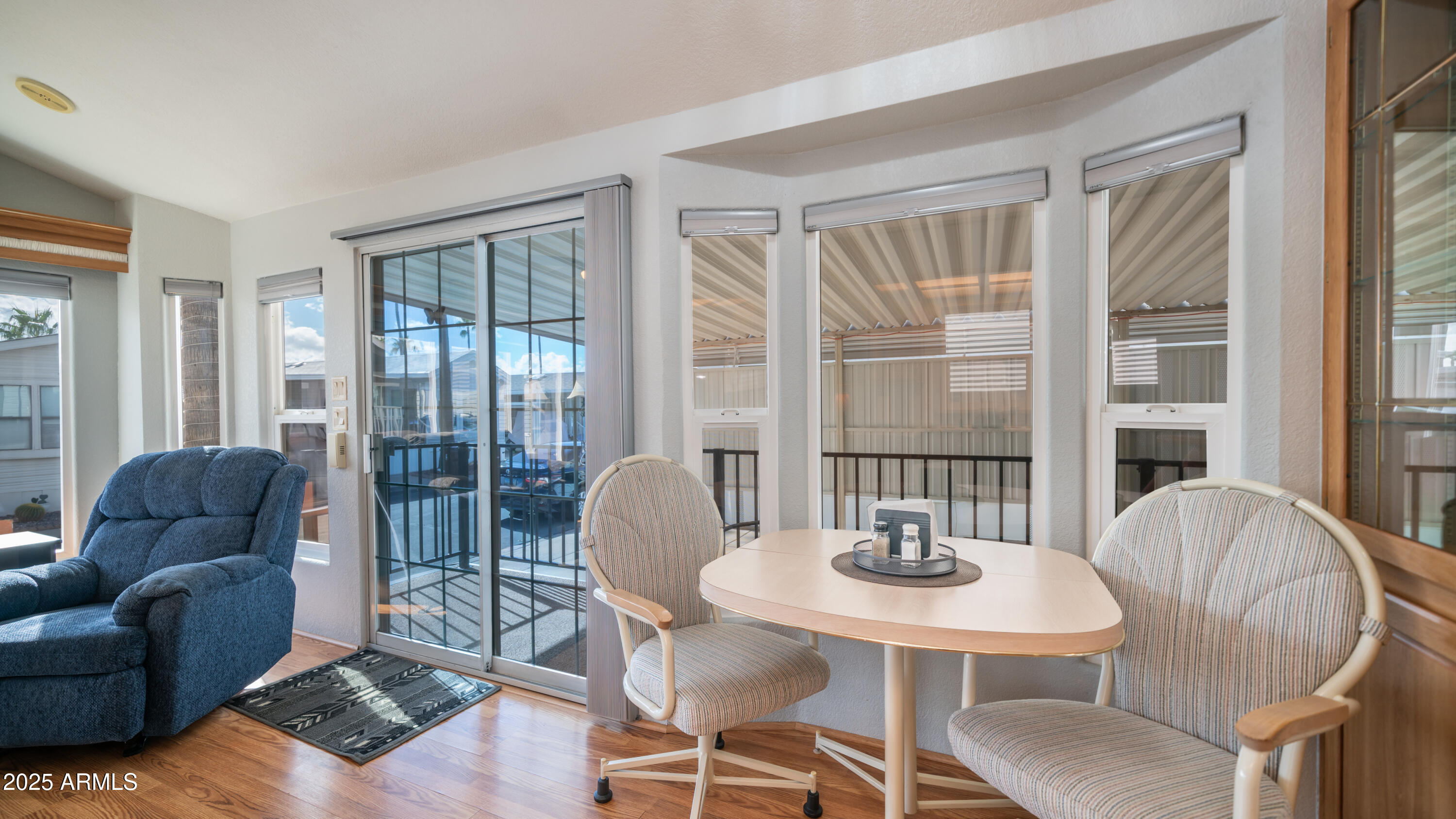656 Gypsum Drive, Unit 656 Apache Junction, AZ 85119 - Photo 8 of 52 a dining room with furniture and wooden floor