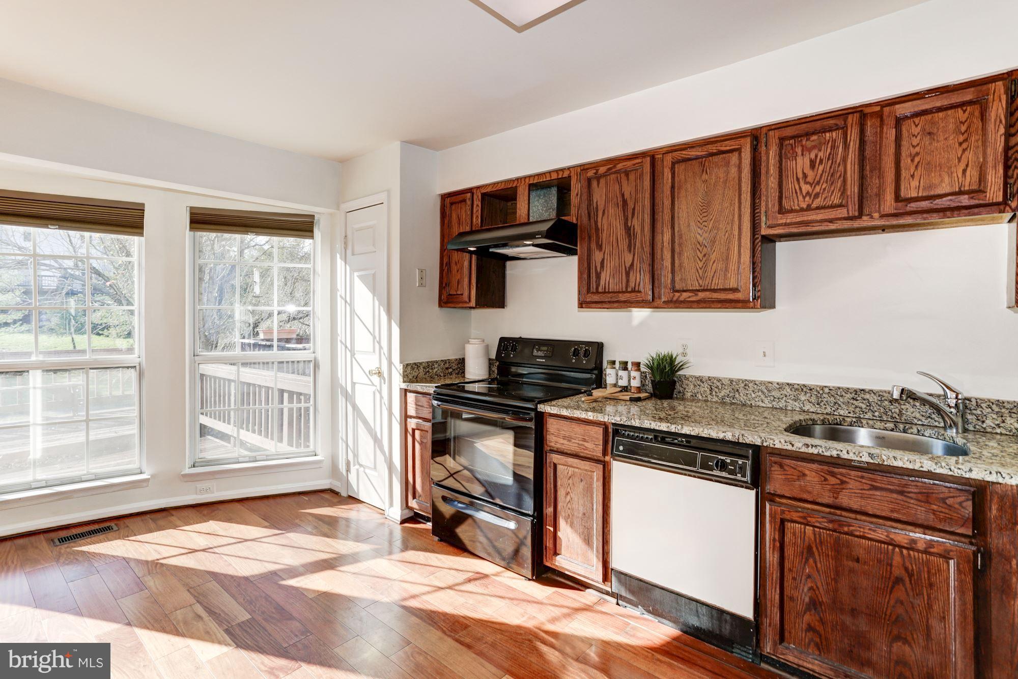 6819 Mayfair Road Laurel, MD 20707 - Photo 18 of 40 Kitchen and view of backyard/deck