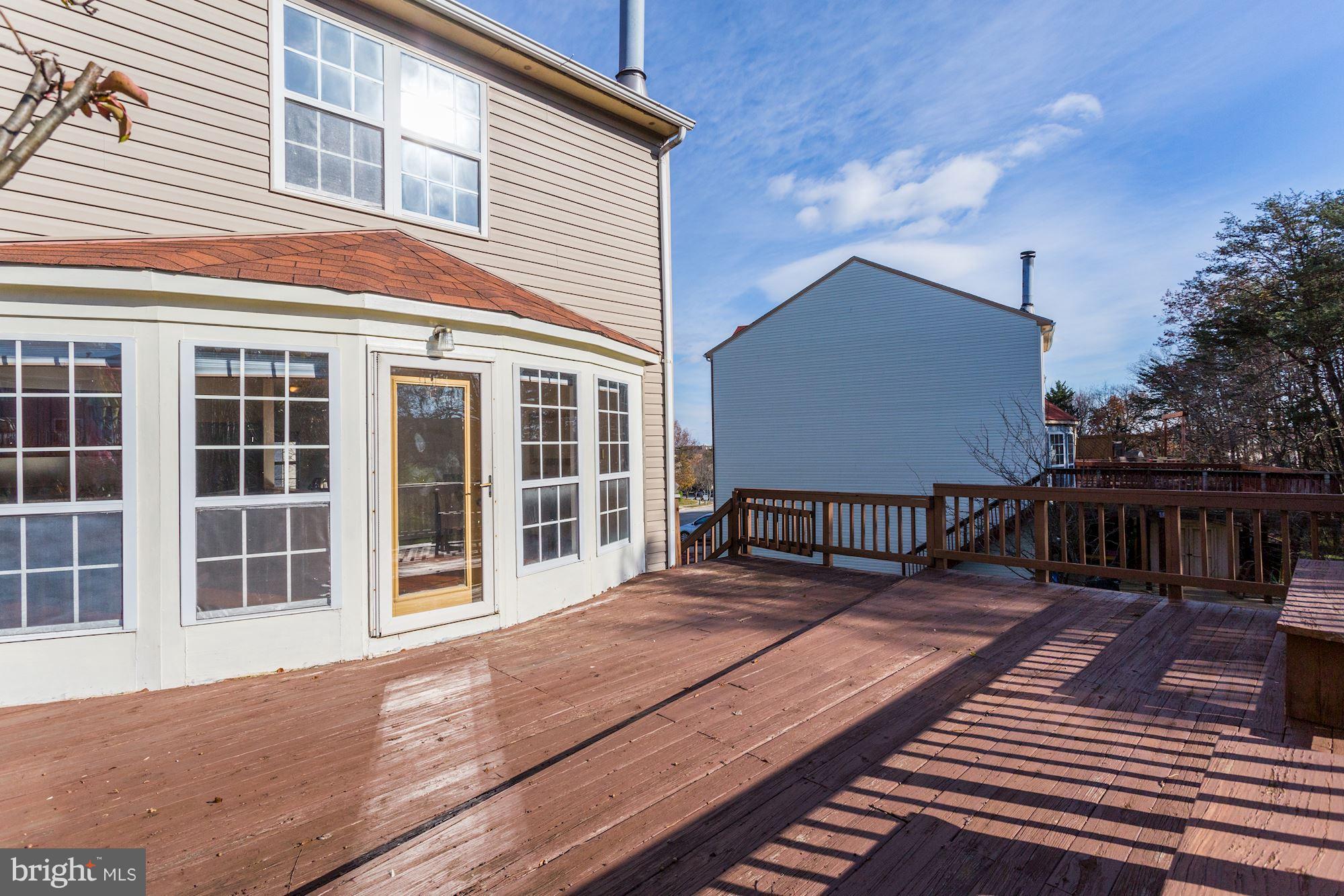 6819 Mayfair Road Laurel, MD 20707 - Photo 30 of 40 Living area and deck perfect for entertaining!