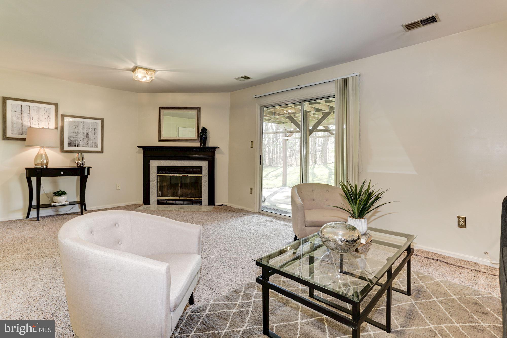 6819 Mayfair Road Laurel, MD 20707 - Photo 9 of 40 1st floor family room with fireplace