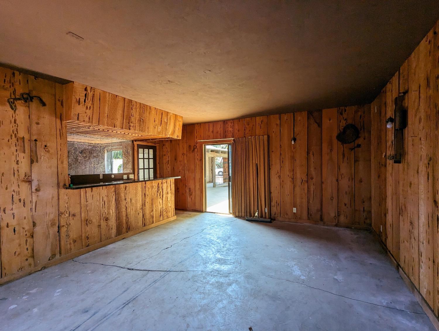 14066 Ave 392 Cutler, CA 93615 - Photo 12 of 18 a view of an empty room with wooden floor and a window