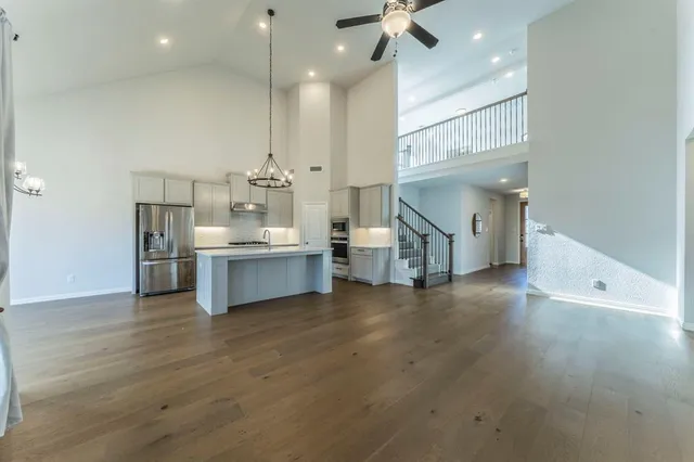 a view of a kitchen with a sink and a living room