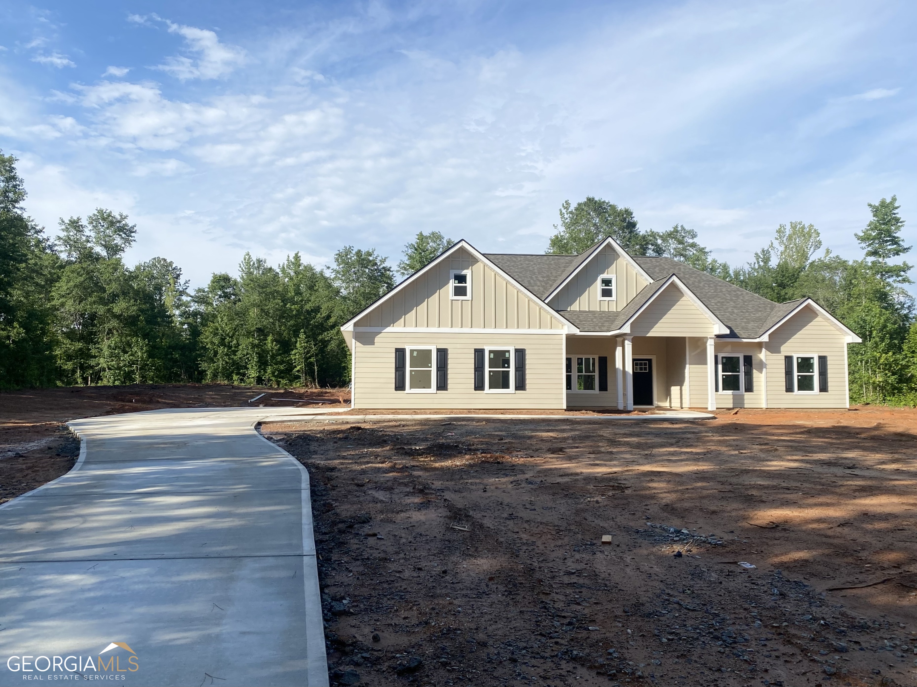 a front view of a house with yard