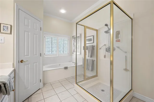 a spacious bathroom with a shower and a glass door