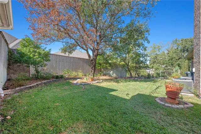 a view of a backyard with sitting area