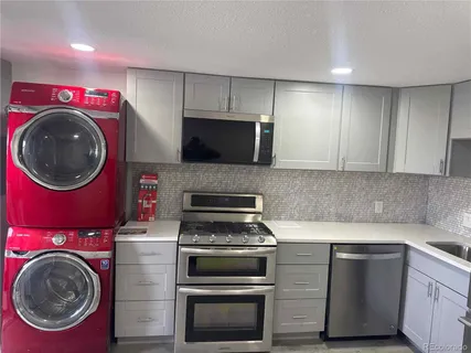 a kitchen with a stove and a microwave