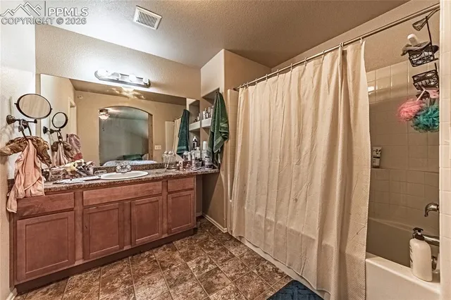 a bathroom with a double vanity sink and mirror
