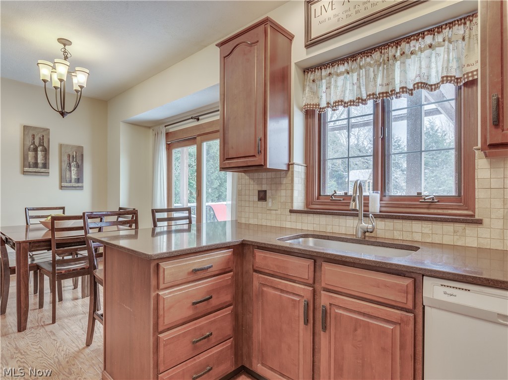 1794 Summerchase Road Northeast Canton, OH 44721 - Photo 11 of 32 Eat in kitchen with granite counter tops and sliders leading to the deck and backyard