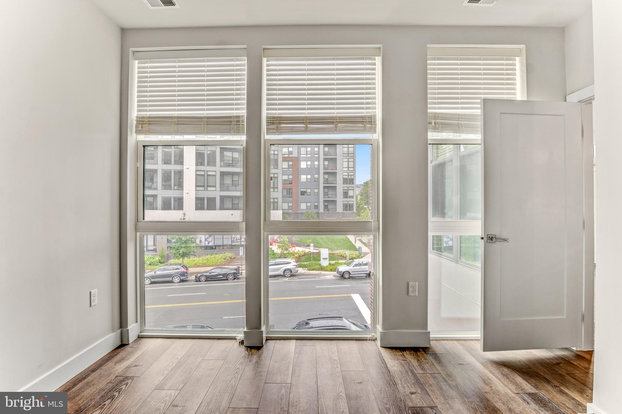 1761 Old Meadow Road, Unit 209 McLean, VA 22102 - Photo 16 of 58 a view of livingroom with furniture and wooden floor