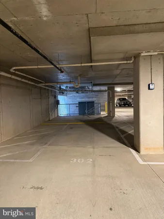 a living room with furniture and large windows