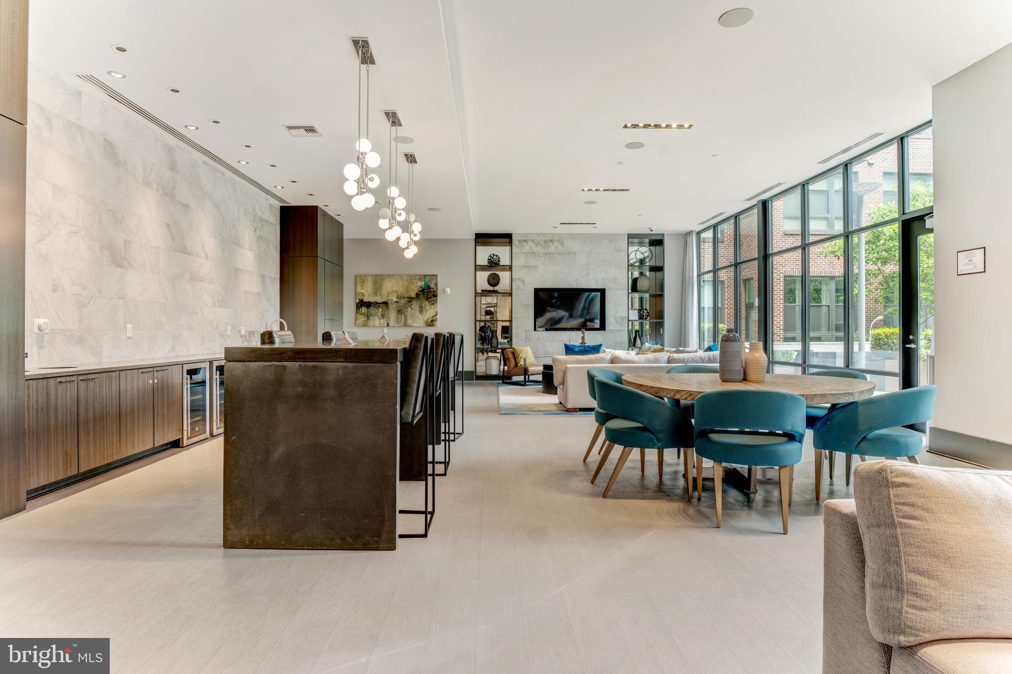 1761 Old Meadow Road, Unit 209 McLean, VA 22102 - Photo 27 of 58 a living room with furniture a fireplace and a chandelier