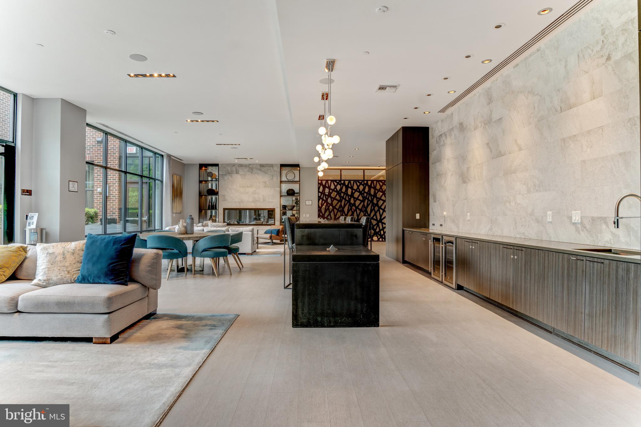 1761 Old Meadow Road, Unit 209 McLean, VA 22102 - Photo 30 of 58 a living room with furniture and a kitchen