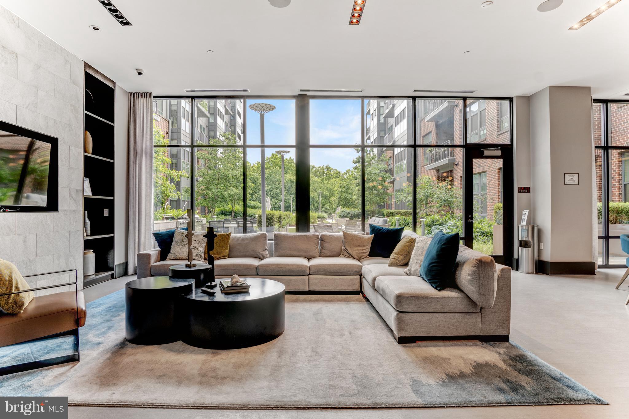 1761 Old Meadow Road, Unit 209 McLean, VA 22102 - Photo 31 of 58 a living room with furniture and large windows