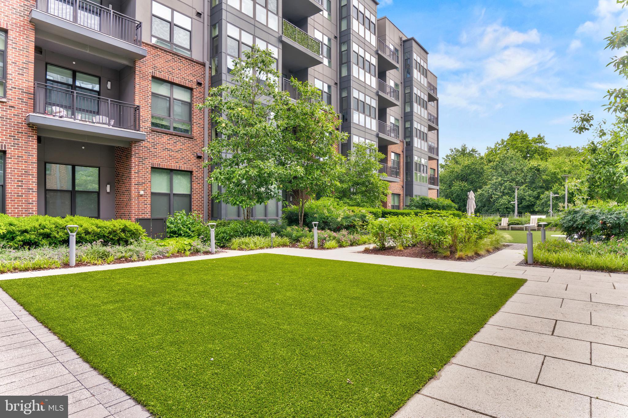 1761 Old Meadow Road, Unit 209 McLean, VA 22102 - Photo 33 of 58 a view of a building with garden