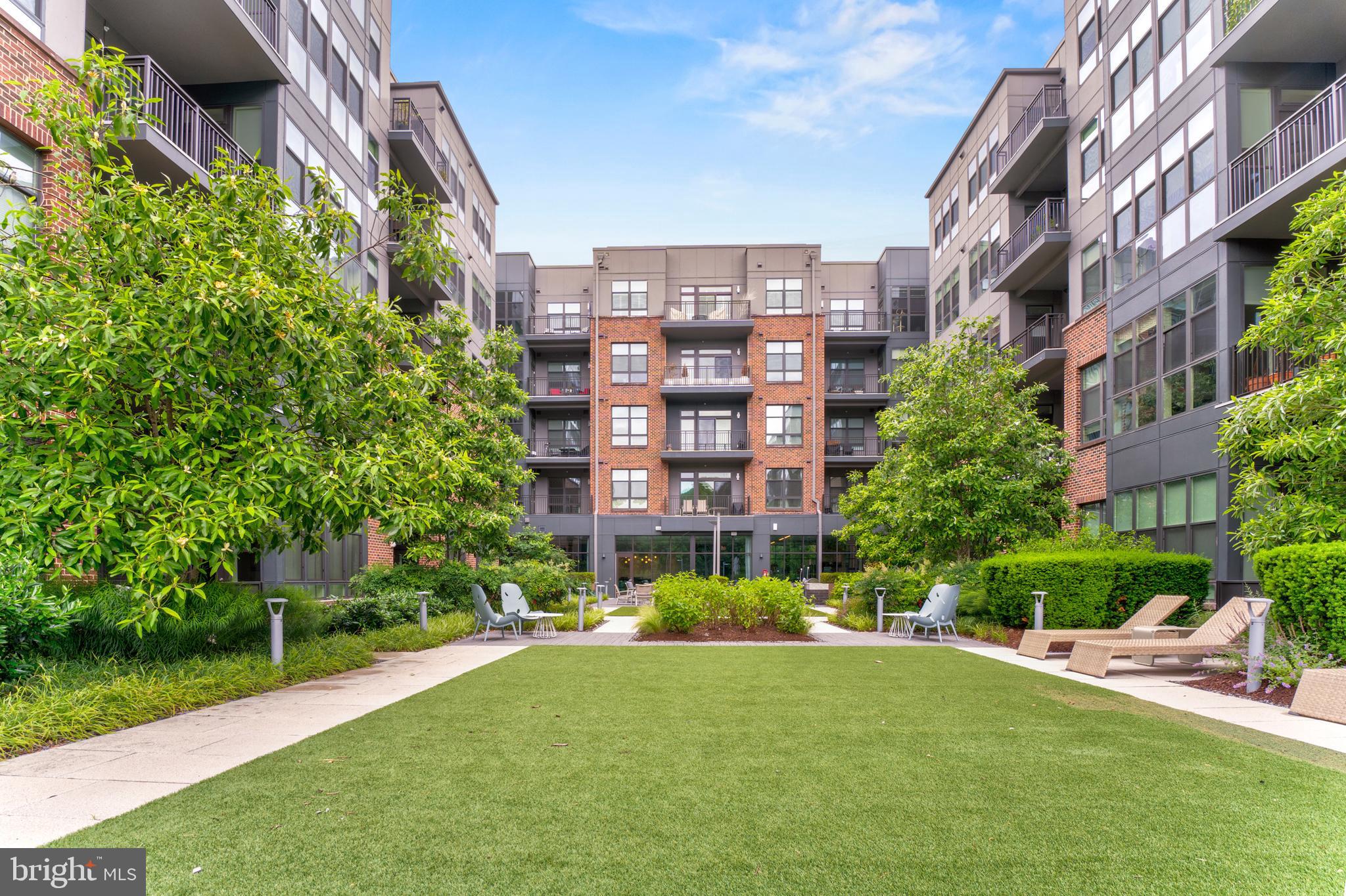 1761 Old Meadow Road, Unit 209 McLean, VA 22102 - Photo 39 of 58 a view of a building and yard with green space