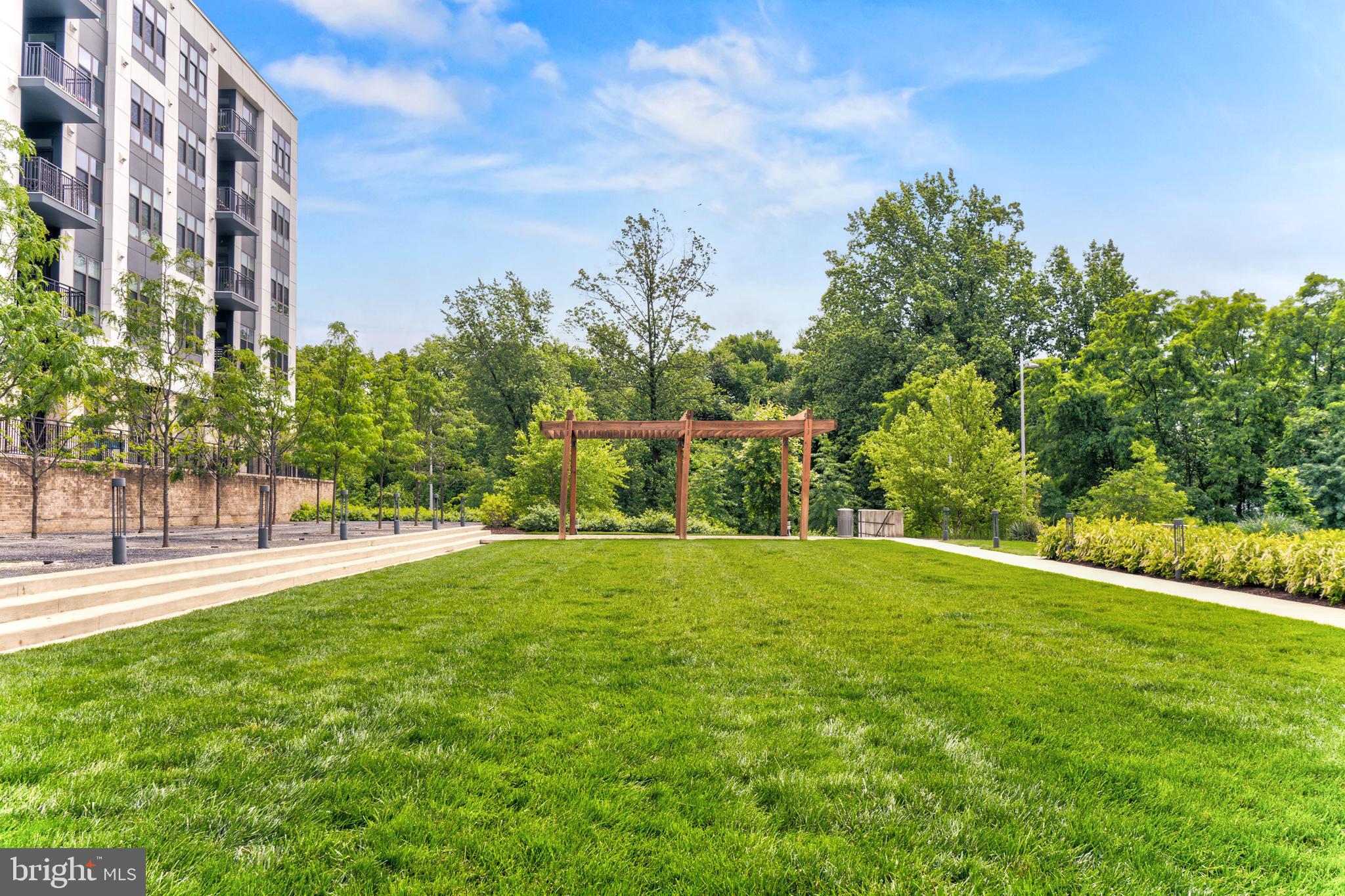1761 Old Meadow Road, Unit 209 McLean, VA 22102 - Photo 47 of 58 a view of an outdoor space and a yard