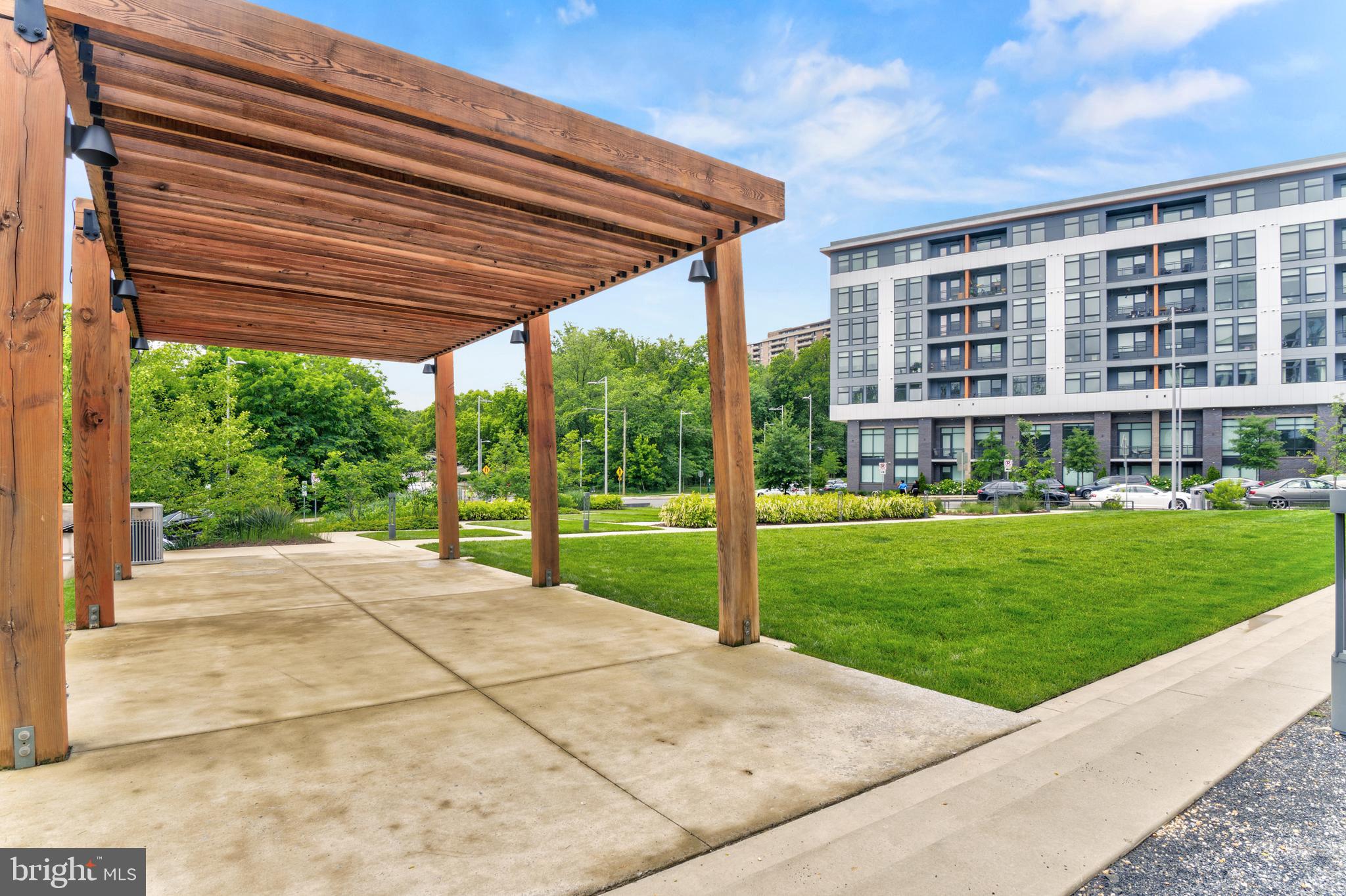 1761 Old Meadow Road, Unit 209 McLean, VA 22102 - Photo 51 of 58 a view of a house with a yard