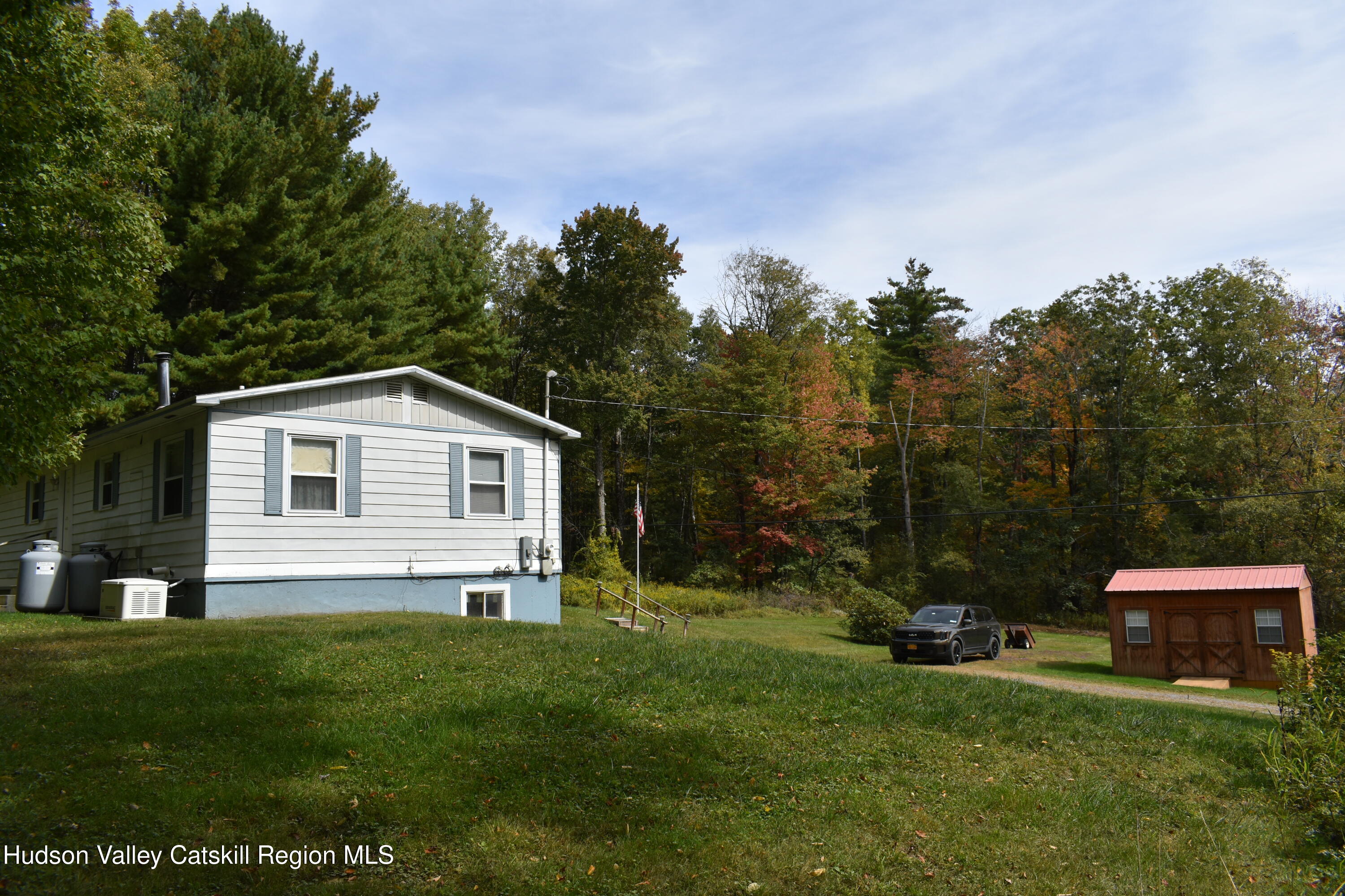 205 Middle Road Austerlitz, NY 12017 - Photo 3 of 15 a front view of a house with a yard