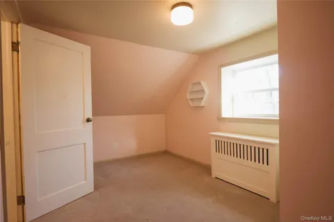 a living room with furniture rug and a flat screen tv