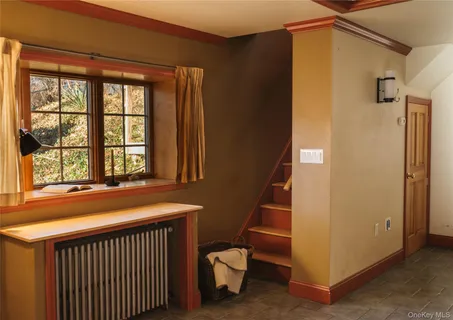 a room with a bed and a window