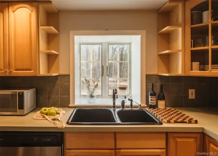 a bathroom with a glass shower door and a bathtub