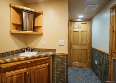 a car parked in front of white house