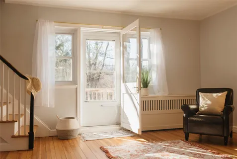 a view of livingroom with furniture and windows