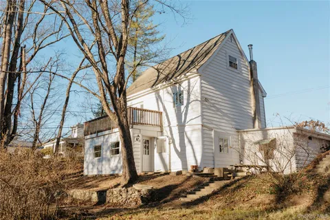 a backyard of a house with large trees