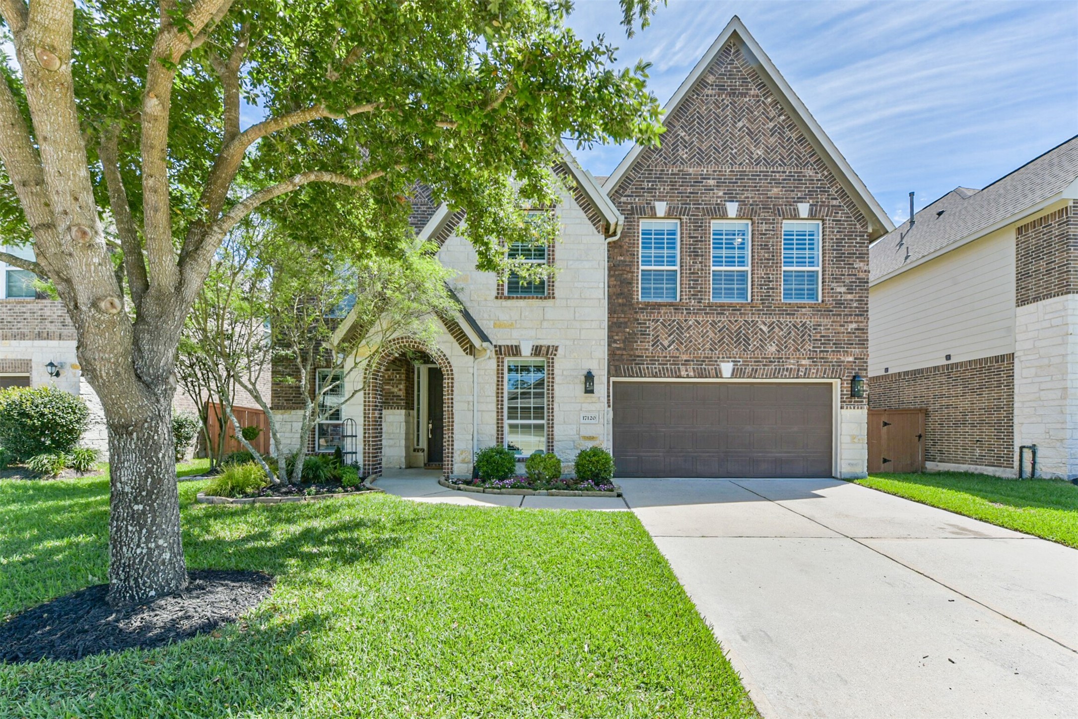 17120 Edge Branch Lane Houston, TX 77044 - Photo 1 of 50 a front view of a house with a yard and garage