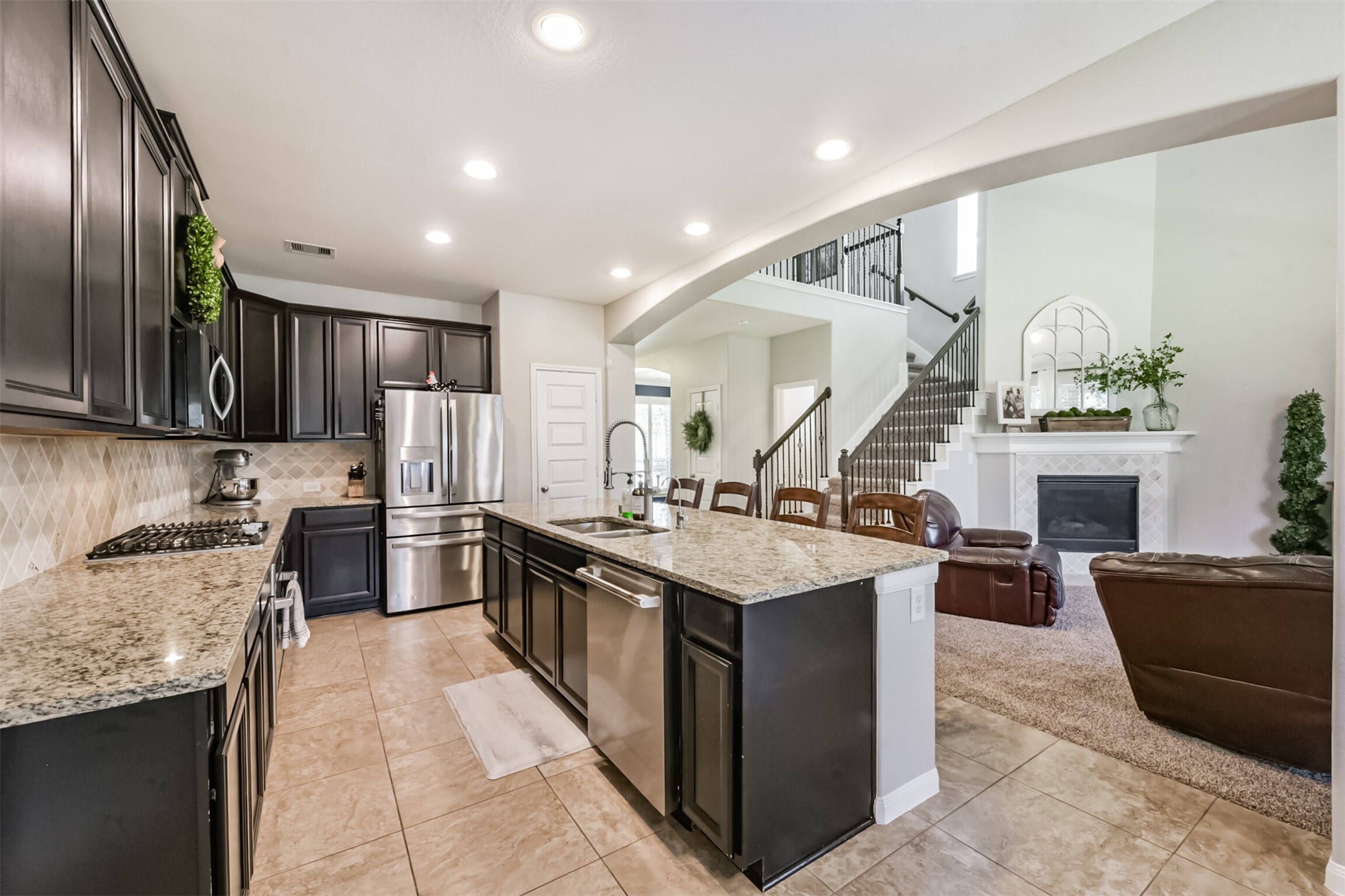 17120 Edge Branch Lane Houston, TX 77044 - Photo 12 of 50 a kitchen with granite countertop a sink counter top space appliances and cabinets