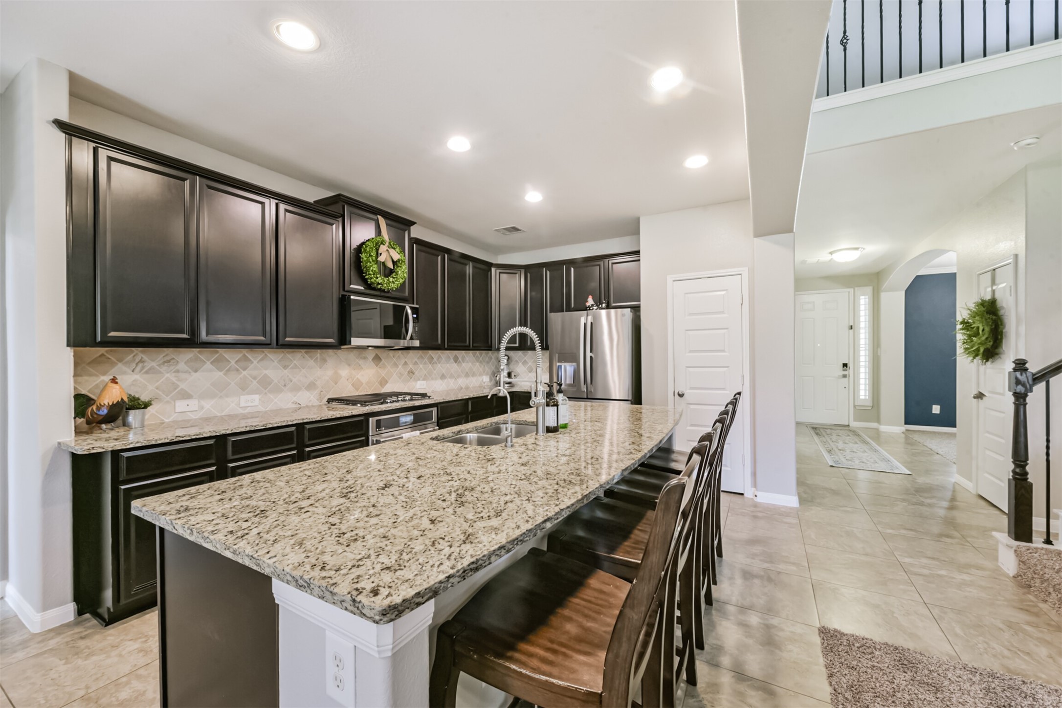 17120 Edge Branch Lane Houston, TX 77044 - Photo 13 of 50 a kitchen with granite countertop stainless steel appliances and a counter top