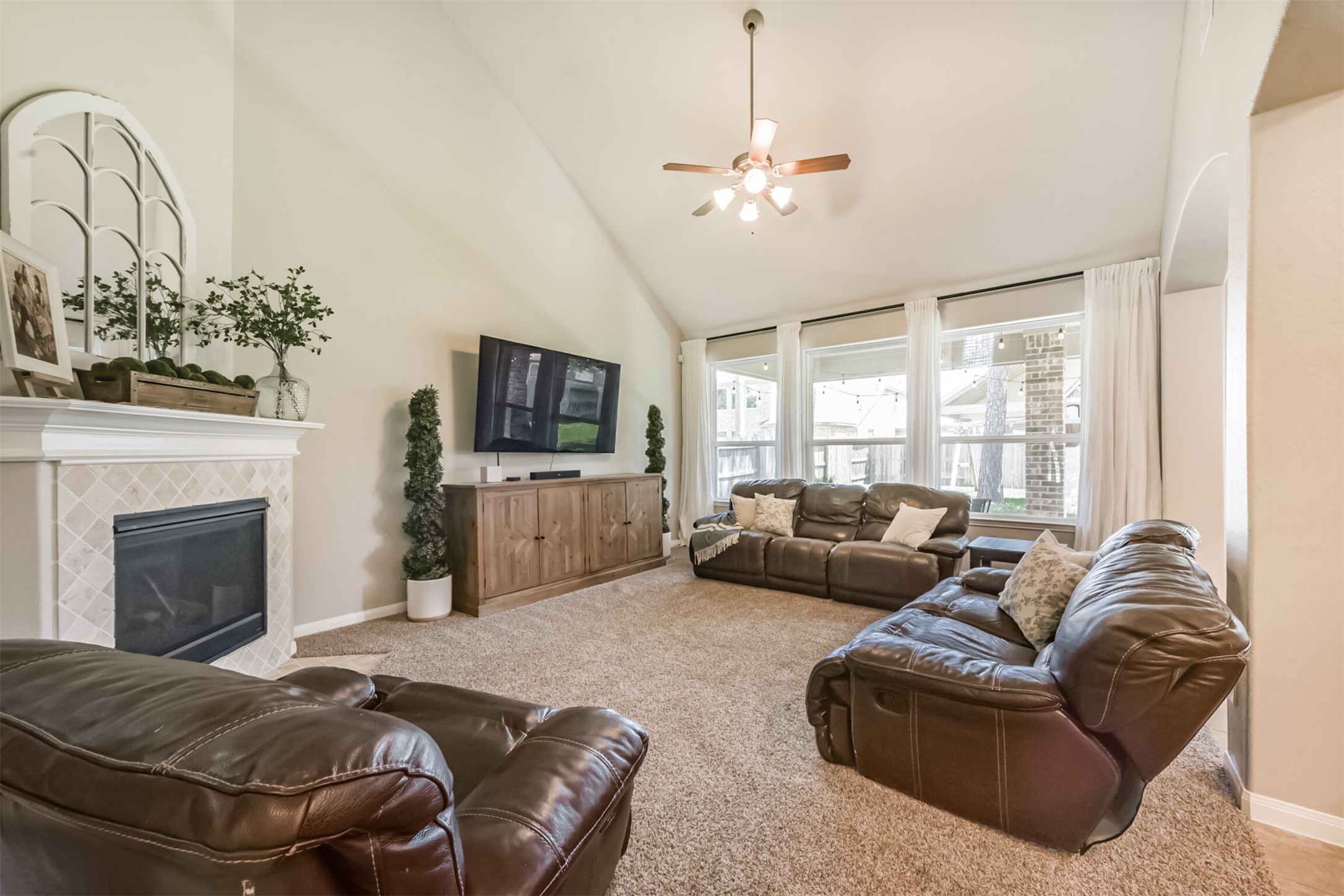 17120 Edge Branch Lane Houston, TX 77044 - Photo 19 of 50 a living room with furniture fireplace and flat screen tv