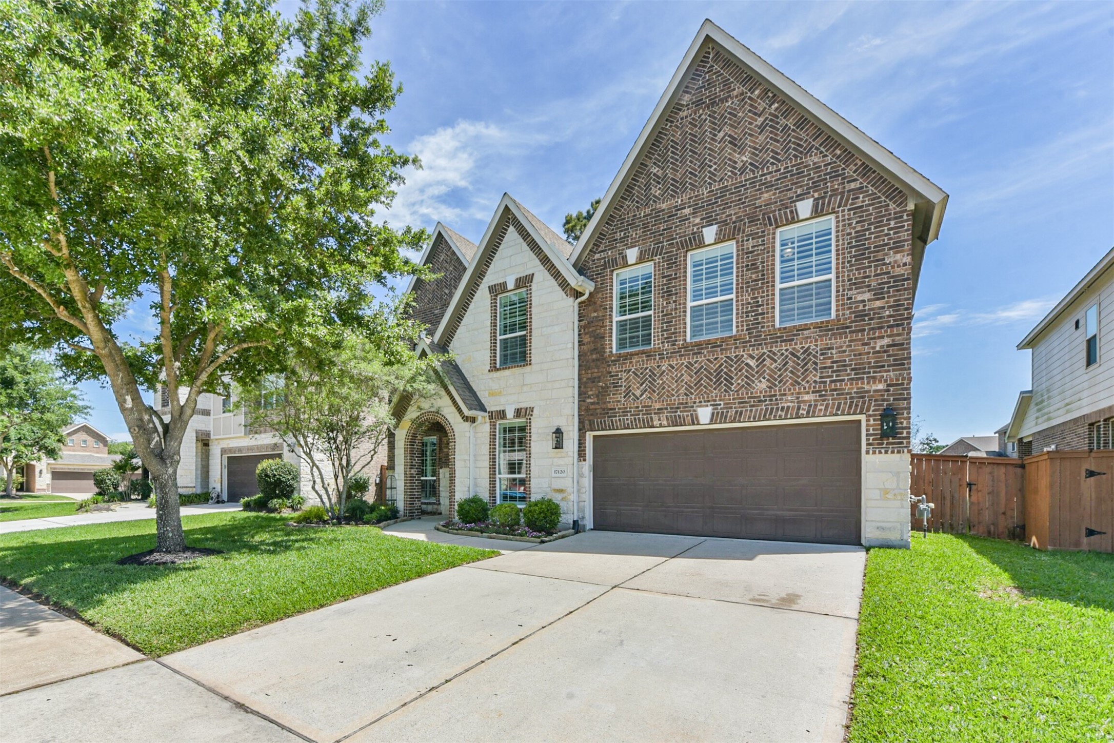 17120 Edge Branch Lane Houston, TX 77044 - Photo 2 of 50 a front view of a house with a yard and a garage