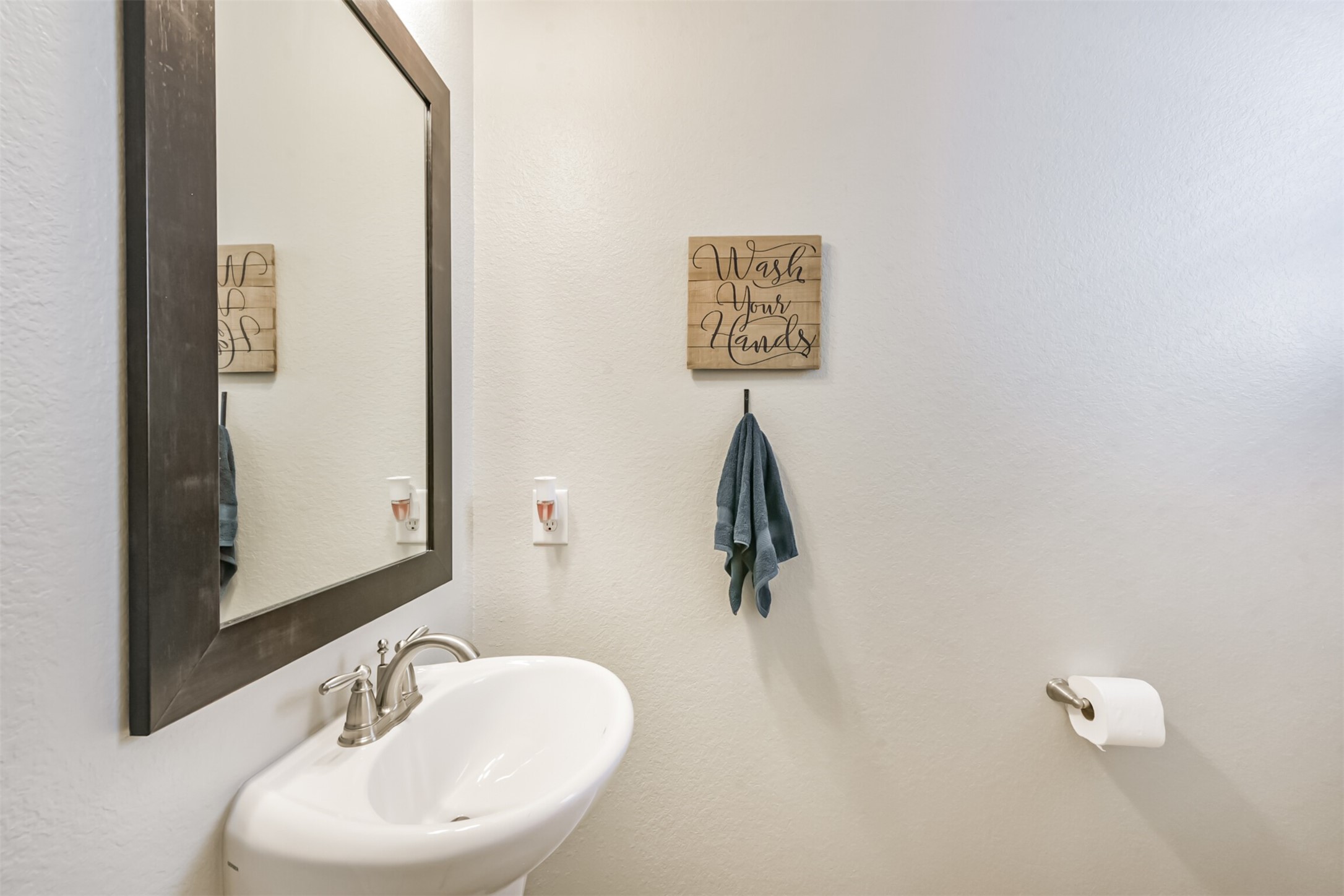 17120 Edge Branch Lane Houston, TX 77044 - Photo 22 of 50 a bathroom with a sink and mirror