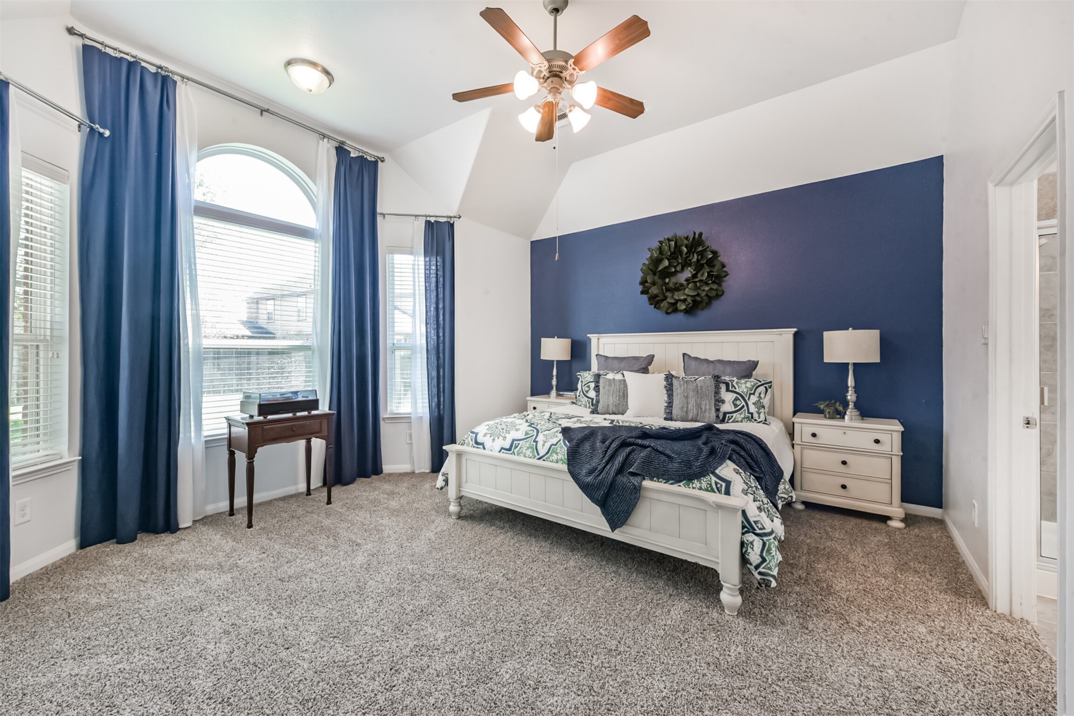 17120 Edge Branch Lane Houston, TX 77044 - Photo 24 of 50 a bedroom with a bed and a large window