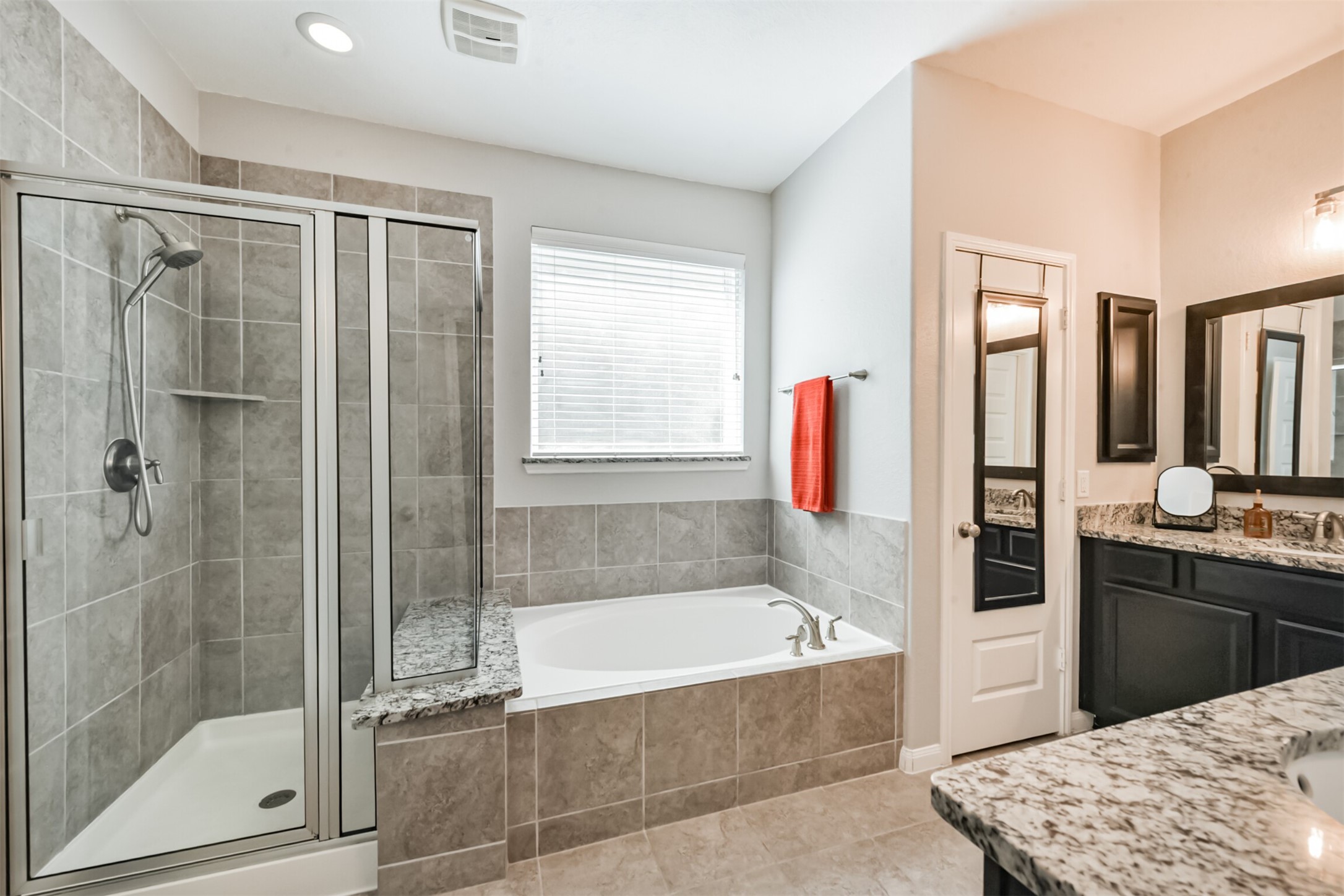 17120 Edge Branch Lane Houston, TX 77044 - Photo 28 of 50 a bathroom with a bath tub and a shower