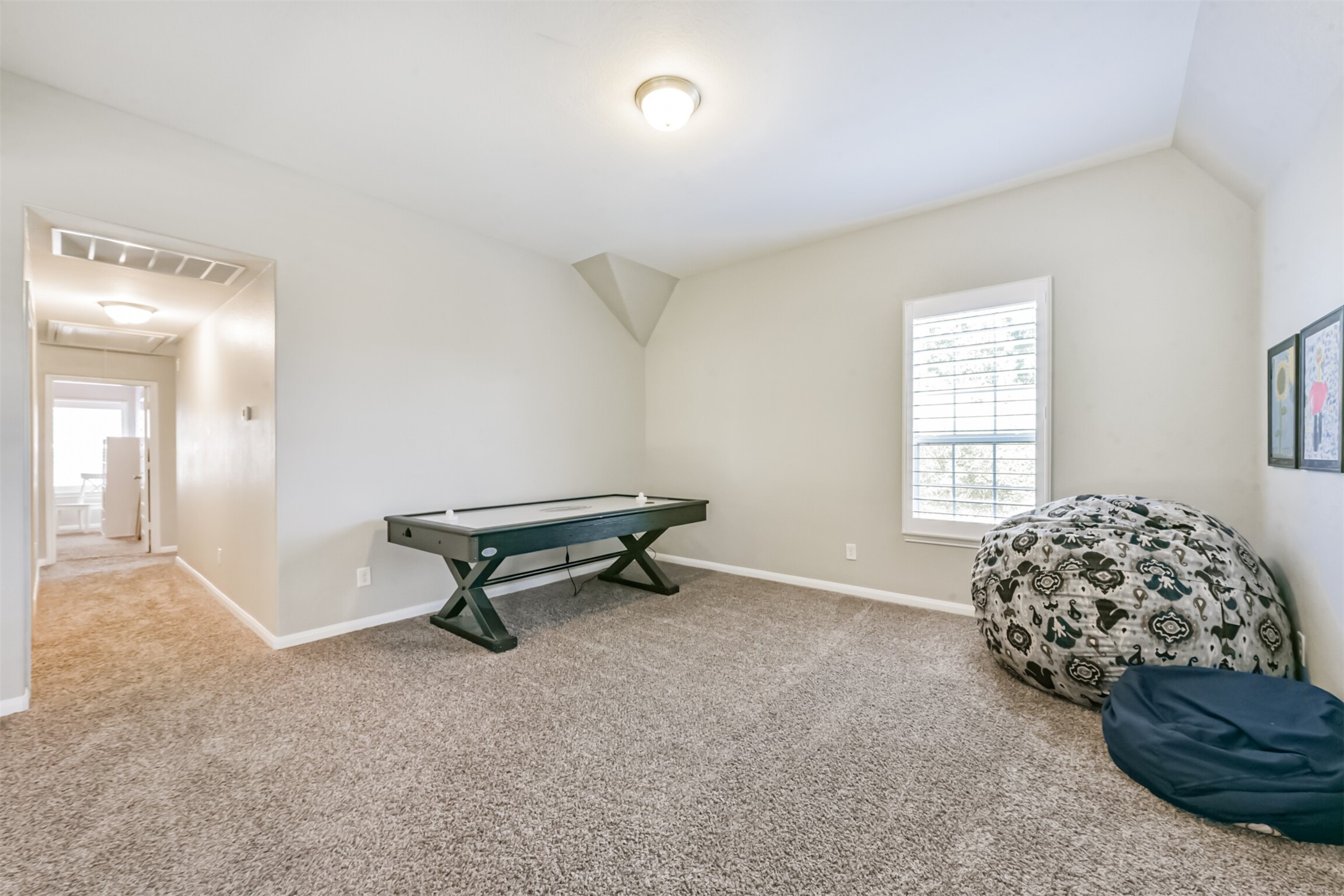 17120 Edge Branch Lane Houston, TX 77044 - Photo 32 of 50 a bedroom with a bed and a window