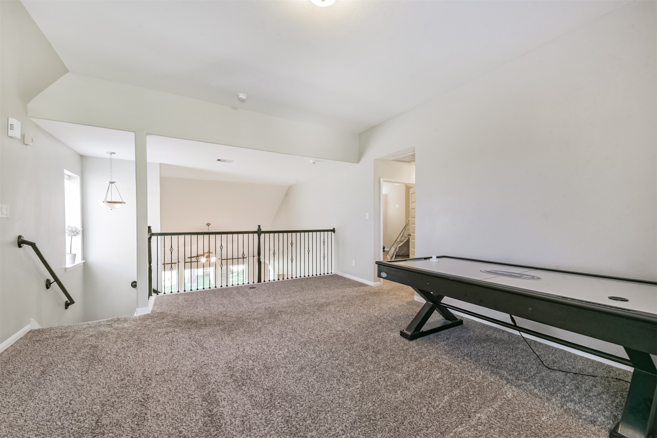 17120 Edge Branch Lane Houston, TX 77044 - Photo 33 of 50 a bedroom with furniture and a window