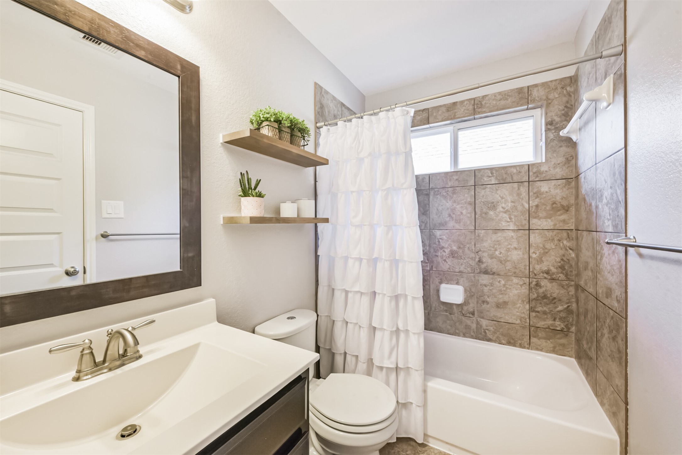 17120 Edge Branch Lane Houston, TX 77044 - Photo 37 of 50 a bathroom with a sink toilet and shower