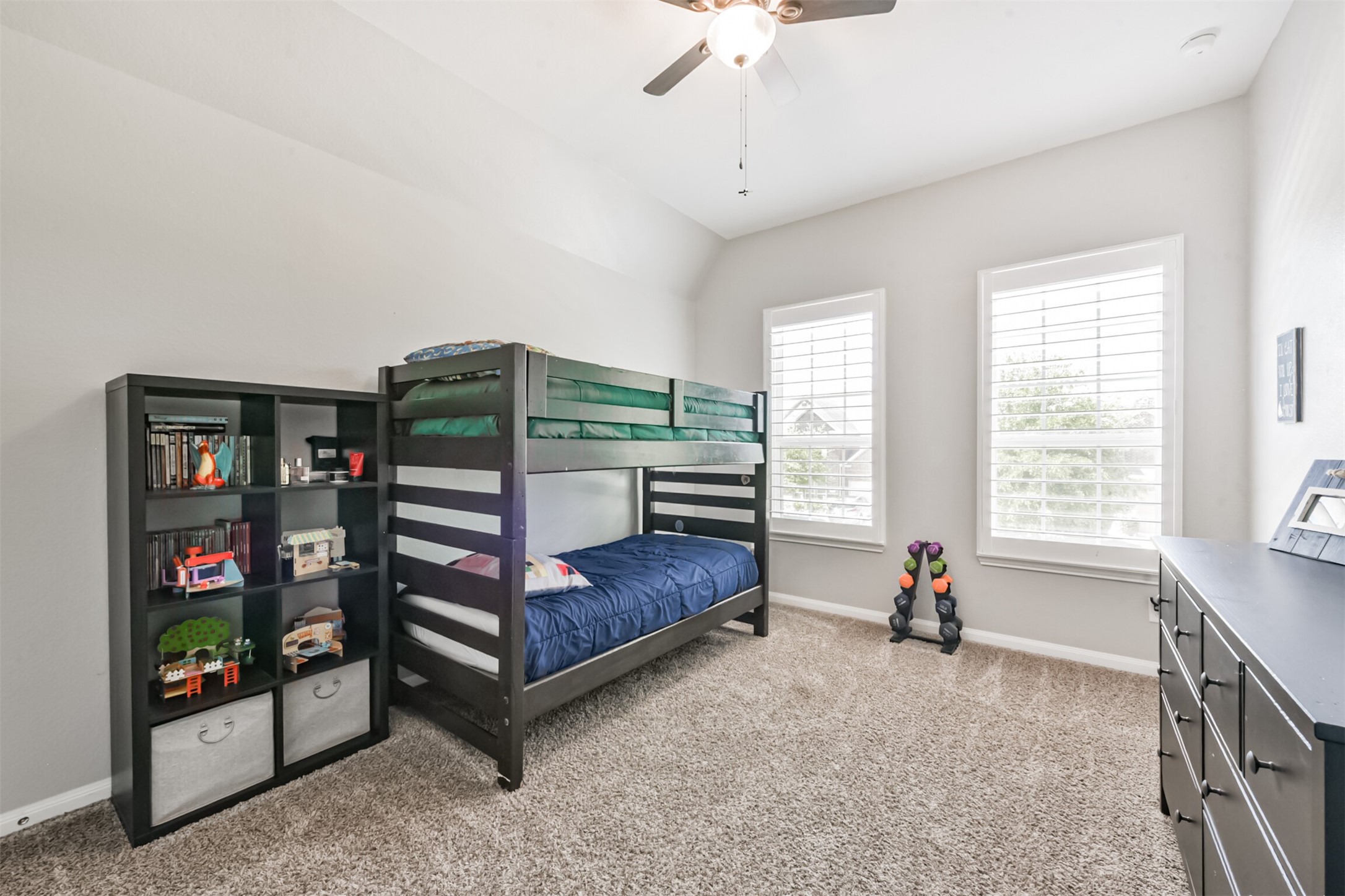 17120 Edge Branch Lane Houston, TX 77044 - Photo 38 of 50 a bedroom with furniture and a flat screen tv