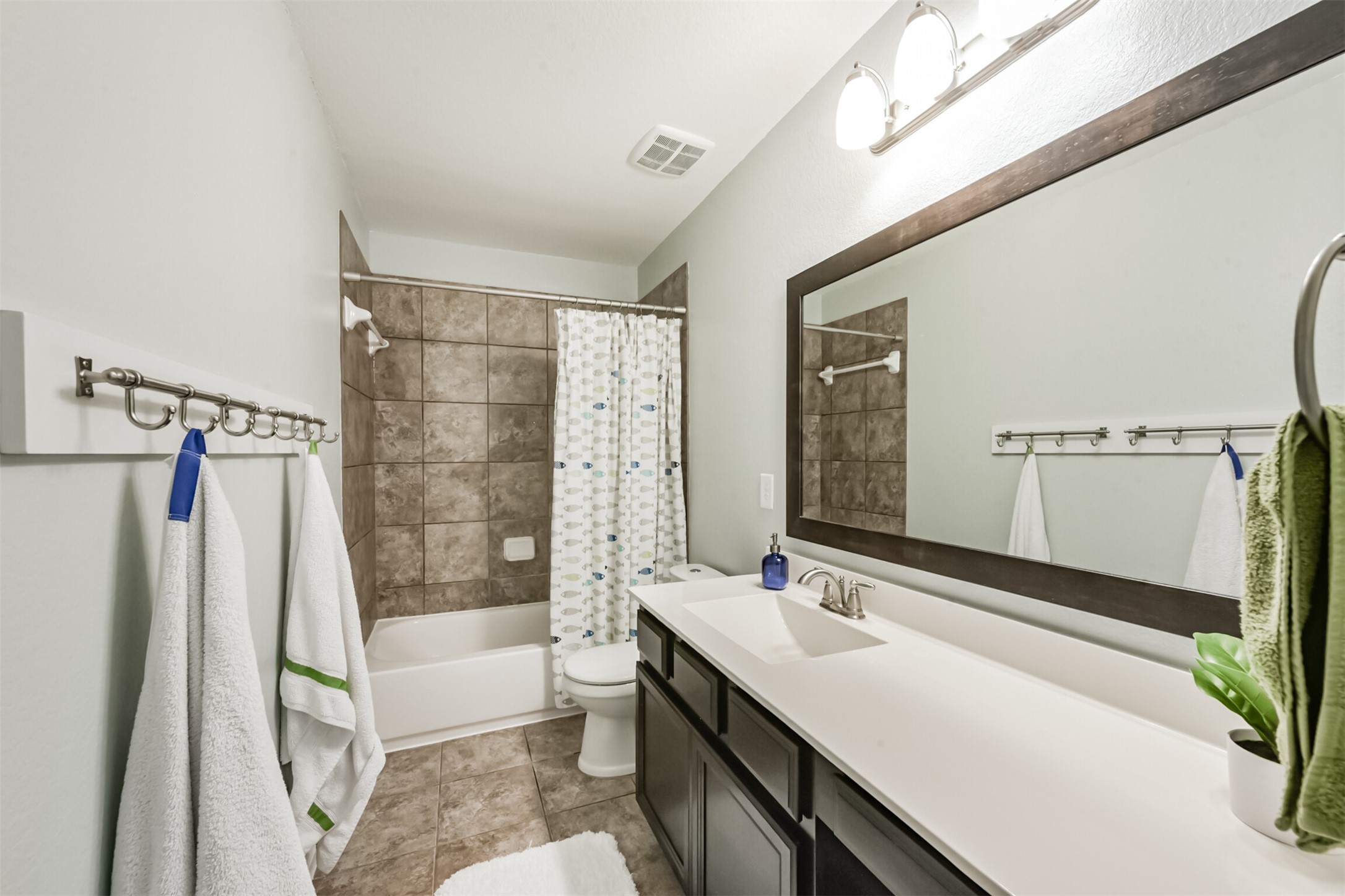 17120 Edge Branch Lane Houston, TX 77044 - Photo 40 of 50 a bathroom with a sink a mirror and a bathtub