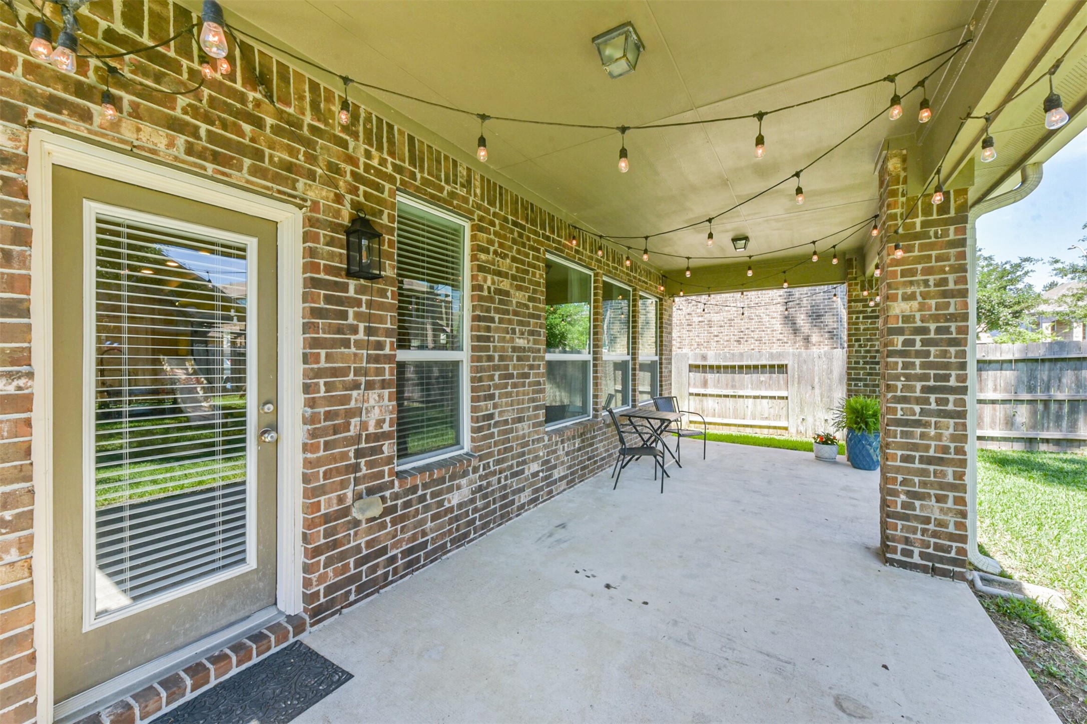 17120 Edge Branch Lane Houston, TX 77044 - Photo 43 of 50 a view of a porch with a table and chairs