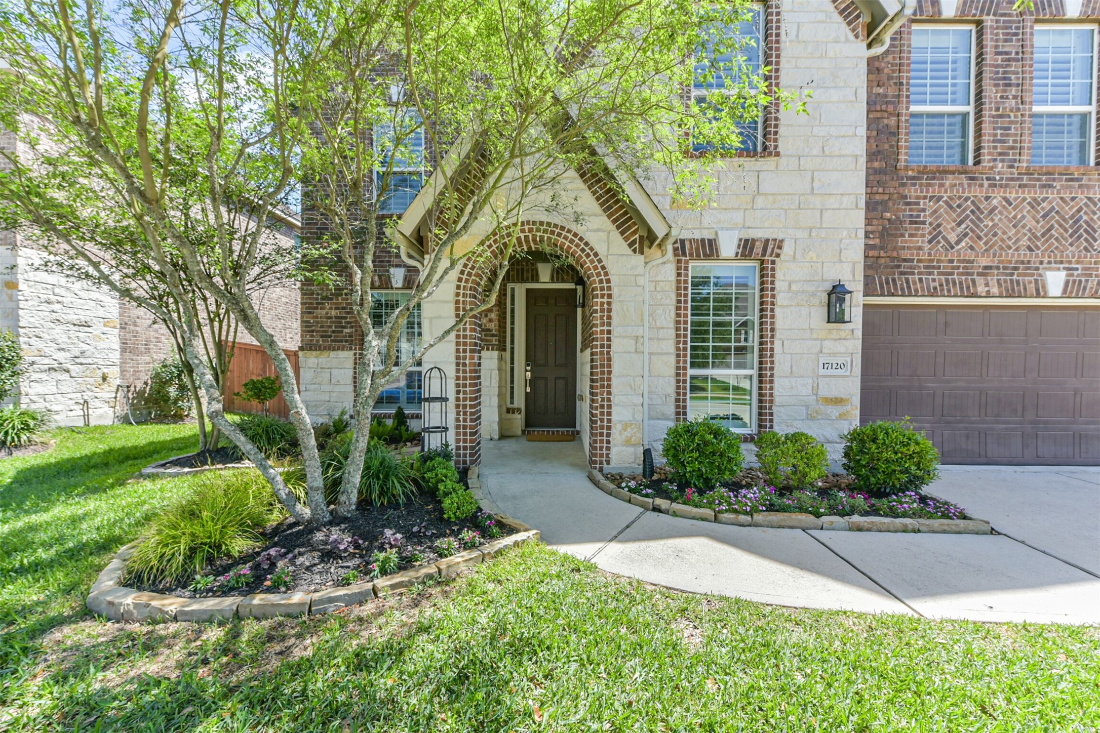 17120 Edge Branch Lane Houston, TX 77044 - Photo 5 of 50 a front view of a house with garden