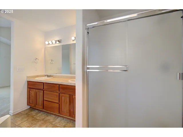 a bathroom with a sink and mirror