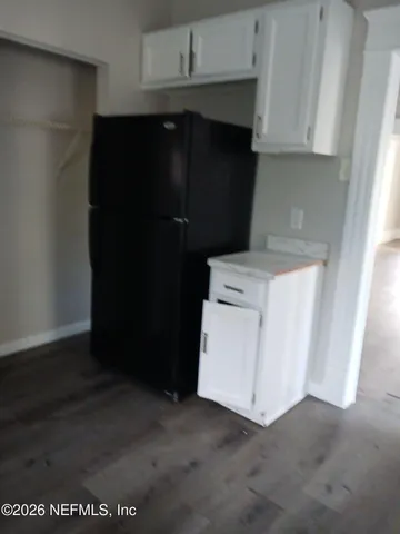 a close view of sink and cabinets